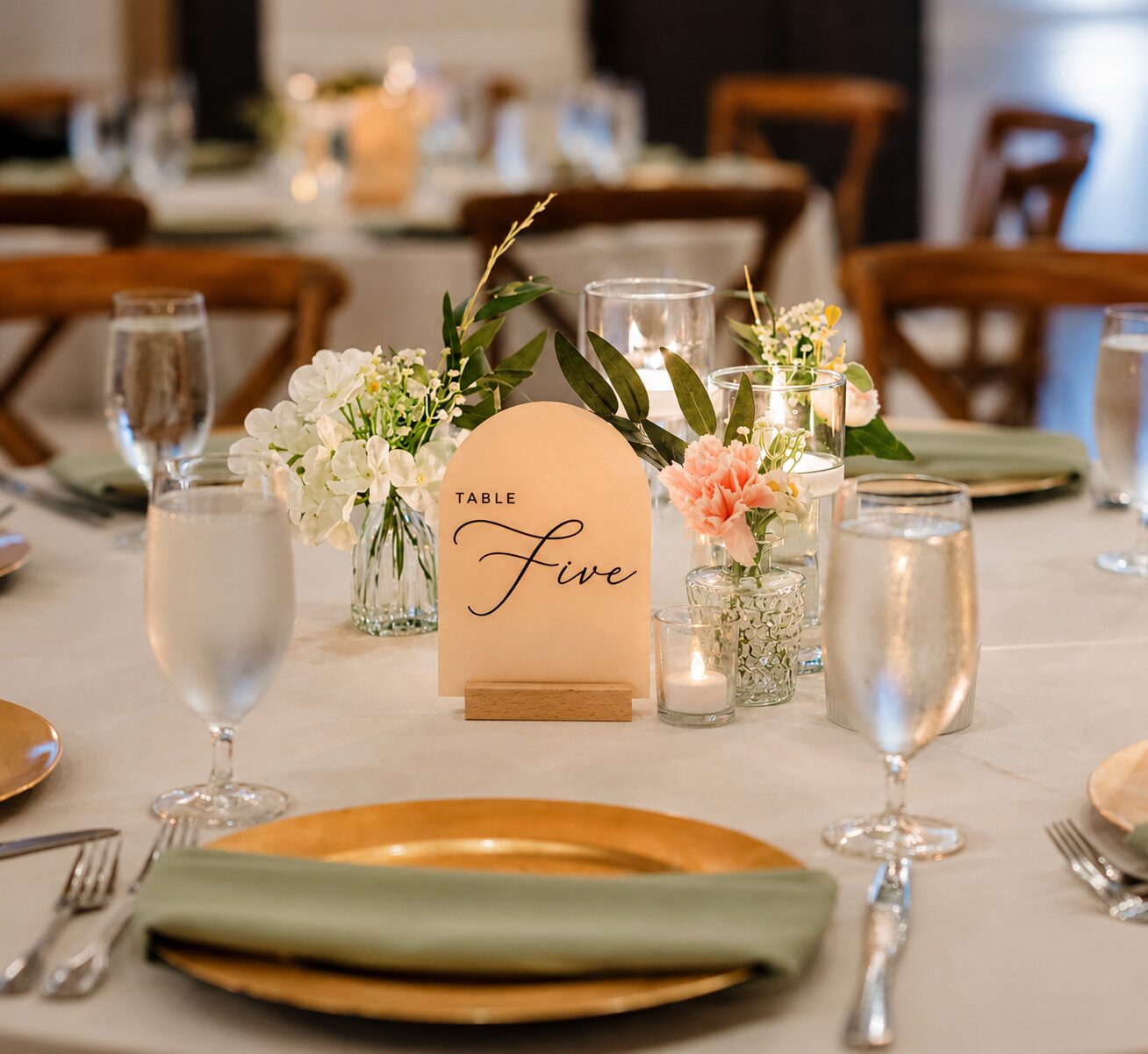 Reception table styled with bud vases and candles